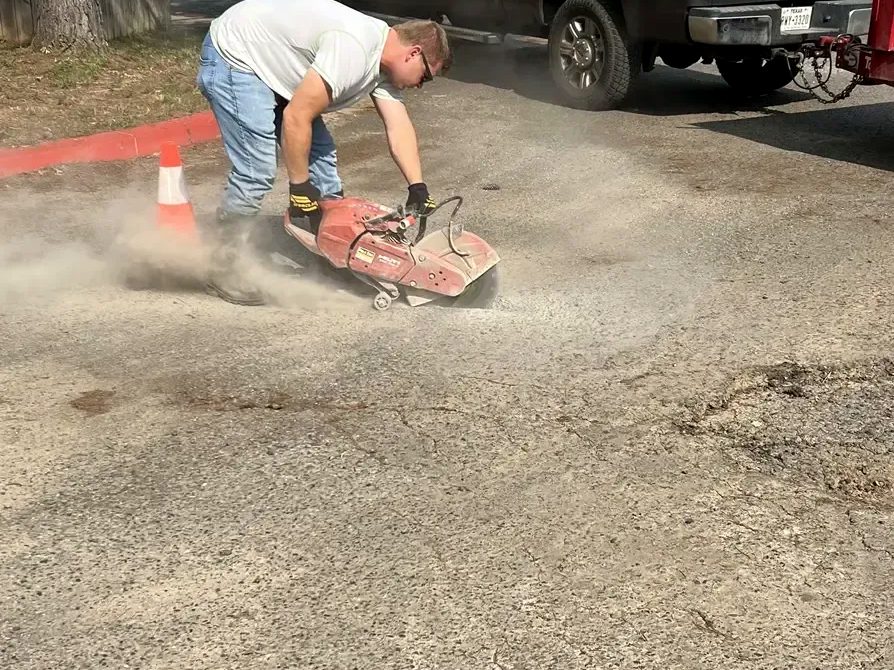 Cutting out damaged pavement for pothole repair